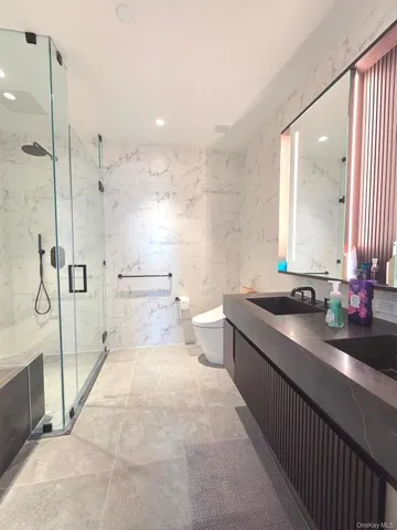 a bed room with a bed and a large window