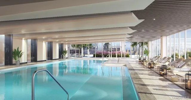 a swimming pool with outdoor seating and yard