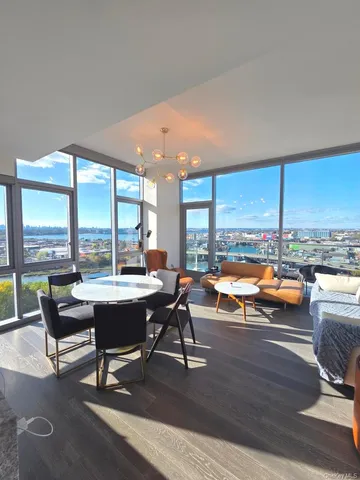 a living room with dining room and kitchen view