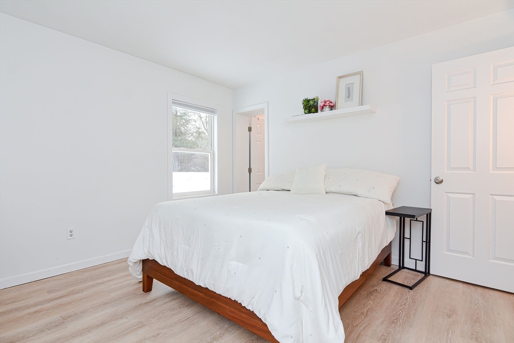 257 Brook Circle Hanover, MA 02339 - Photo 16 of 23 a bedroom with a bed and a window