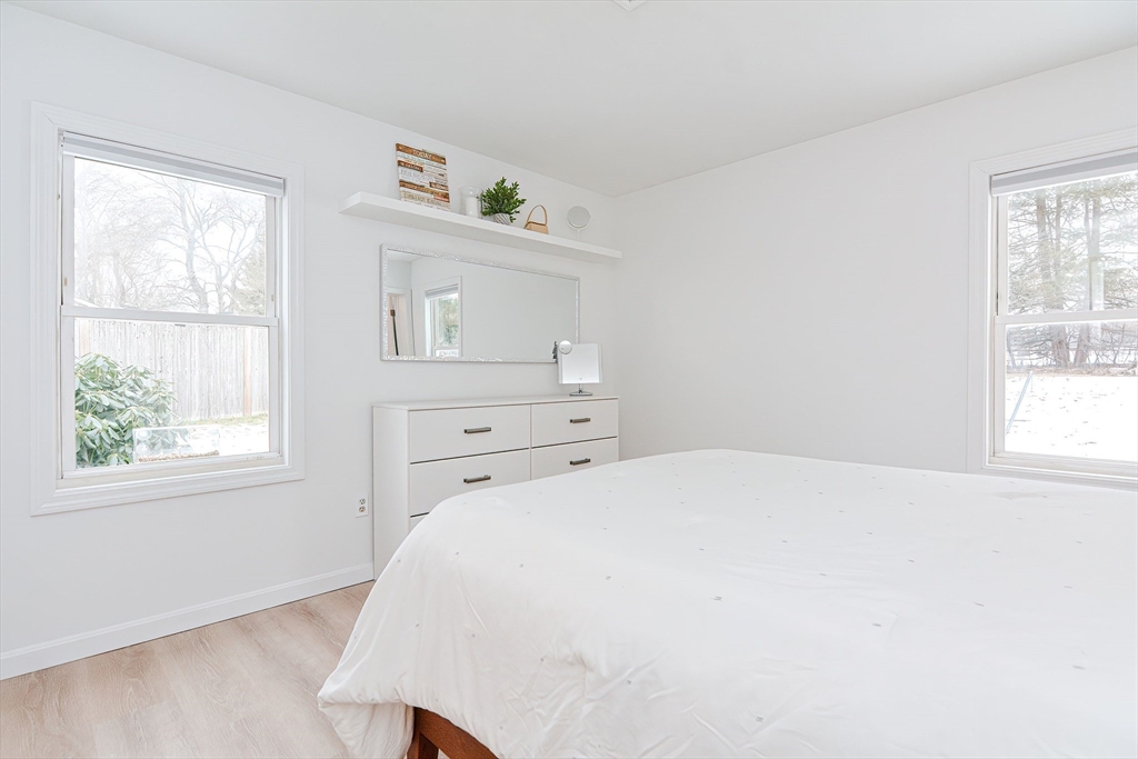 257 Brook Circle Hanover, MA 02339 - Photo 17 of 23 a bedroom with a bed and a window