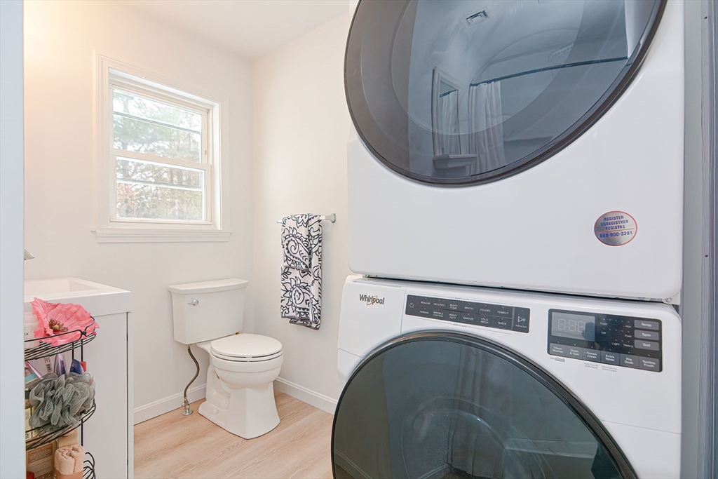 257 Brook Circle Hanover, MA 02339 - Photo 20 of 23 a bathroom with a toilet and a mirror