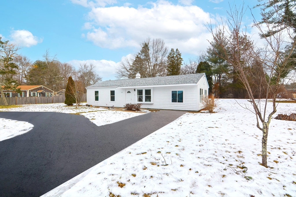 257 Brook Circle Hanover, MA 02339 - Photo 2 of 23 a view of house with snow on the background
