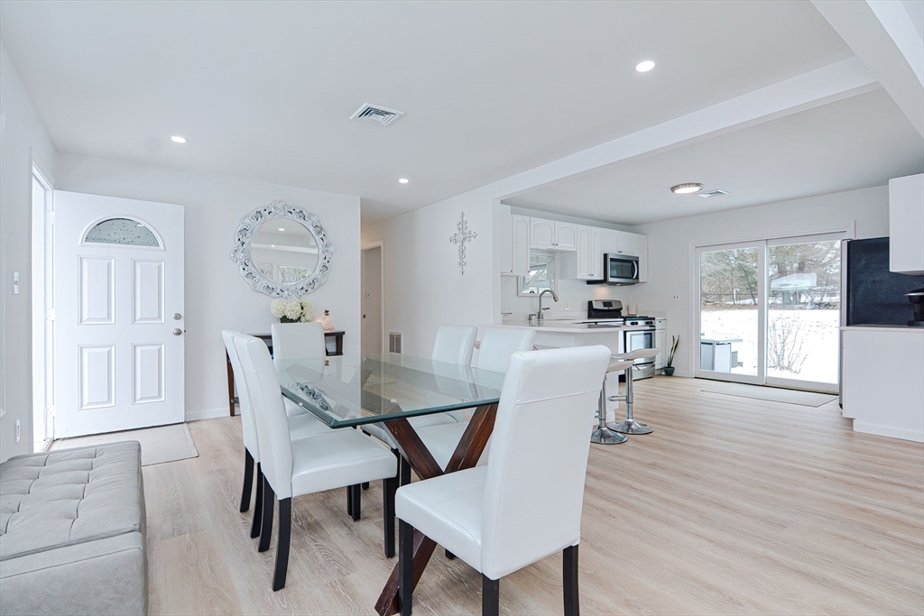 257 Brook Circle Hanover, MA 02339 - Photo 4 of 23 a dining room with furniture and wooden floor