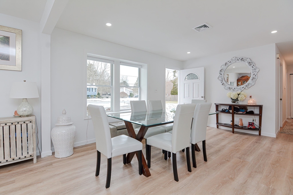 257 Brook Circle Hanover, MA 02339 - Photo 5 of 23 a view of a dining room with furniture and wooden floor