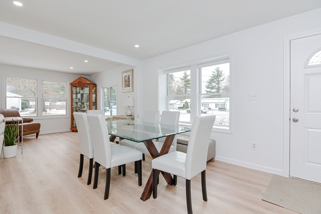 257 Brook Circle Hanover, MA 02339 - Photo 7 of 23 a view of a dining room with furniture window and outside view