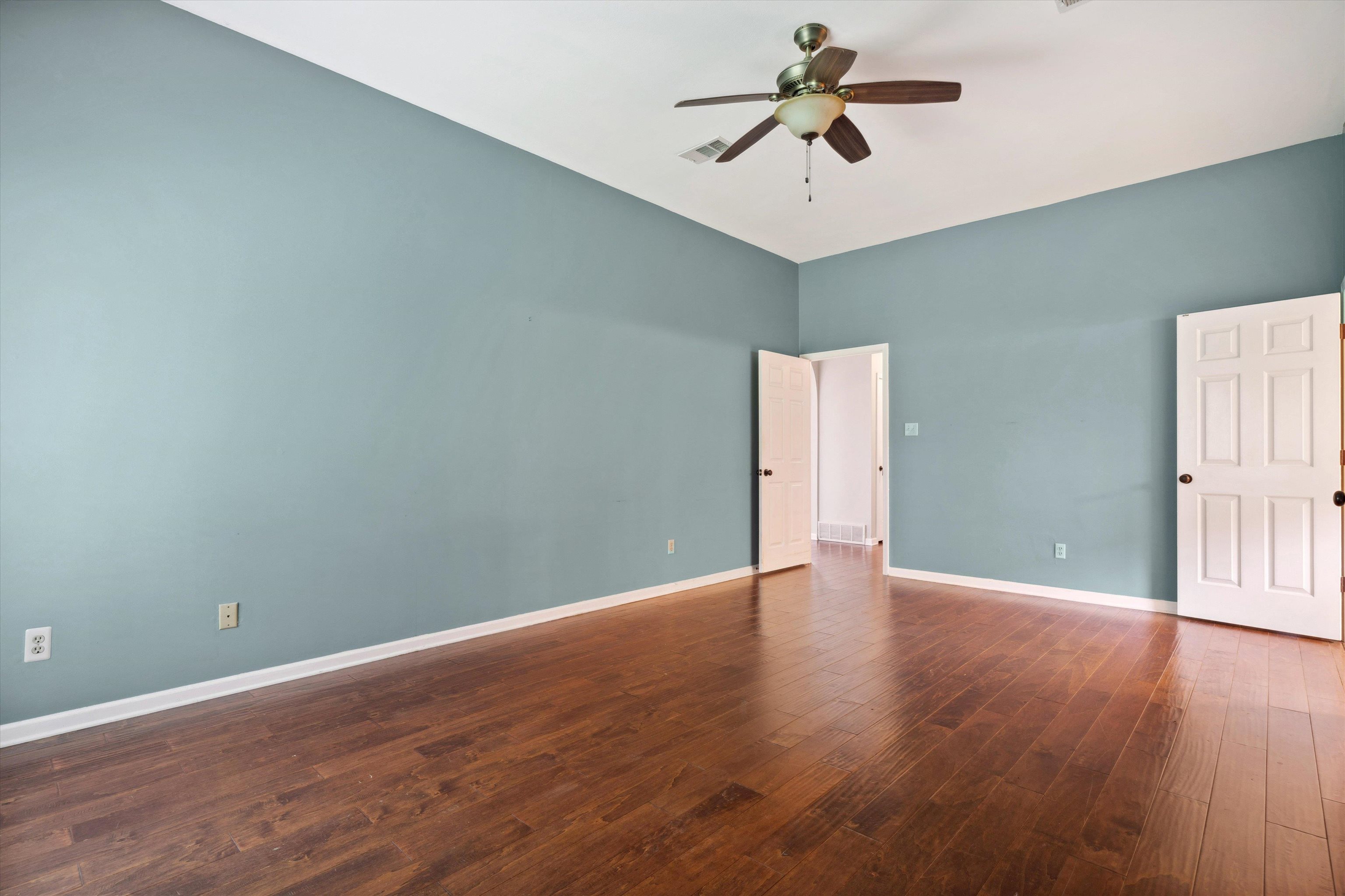 852 Joe Drive Collierville, TN 38017 - Photo 19 of 27 a view of a room with wooden floor and a ceiling fan