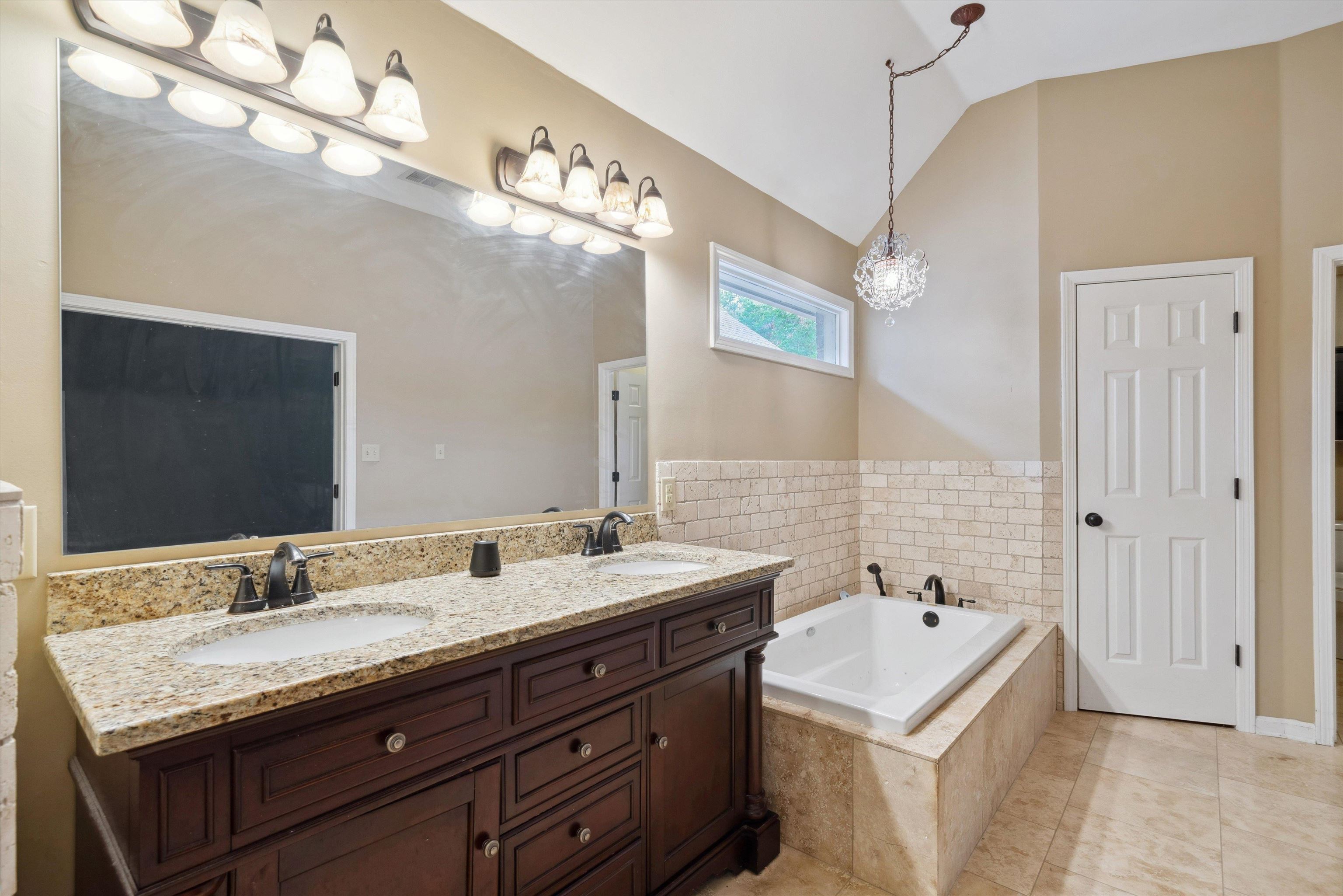 852 Joe Drive Collierville, TN 38017 - Photo 20 of 27 a bathroom with a sink double vanity granite and a mirror