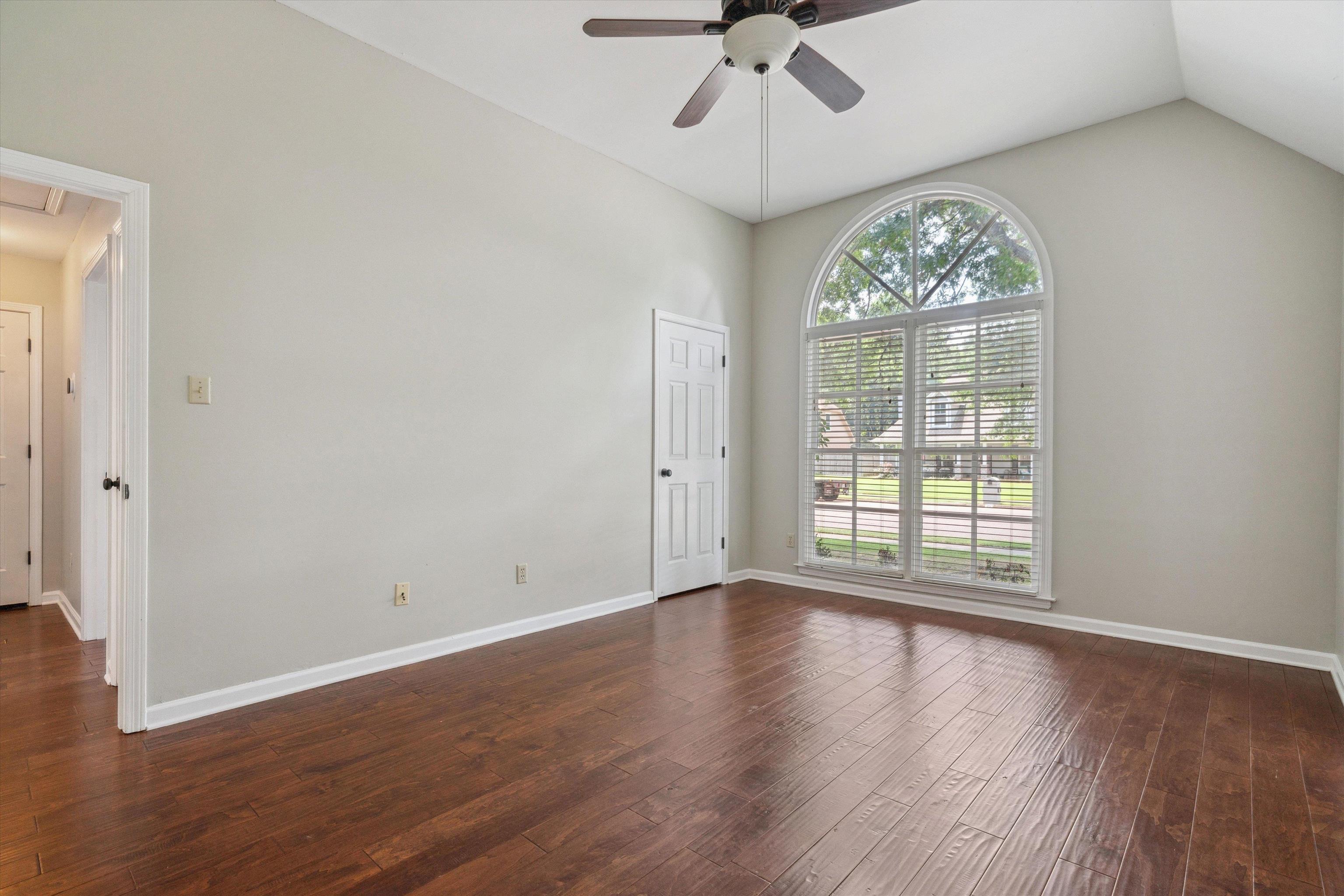 852 Joe Drive Collierville, TN 38017 - Photo 25 of 27 a view of an empty room with wooden floor and a window