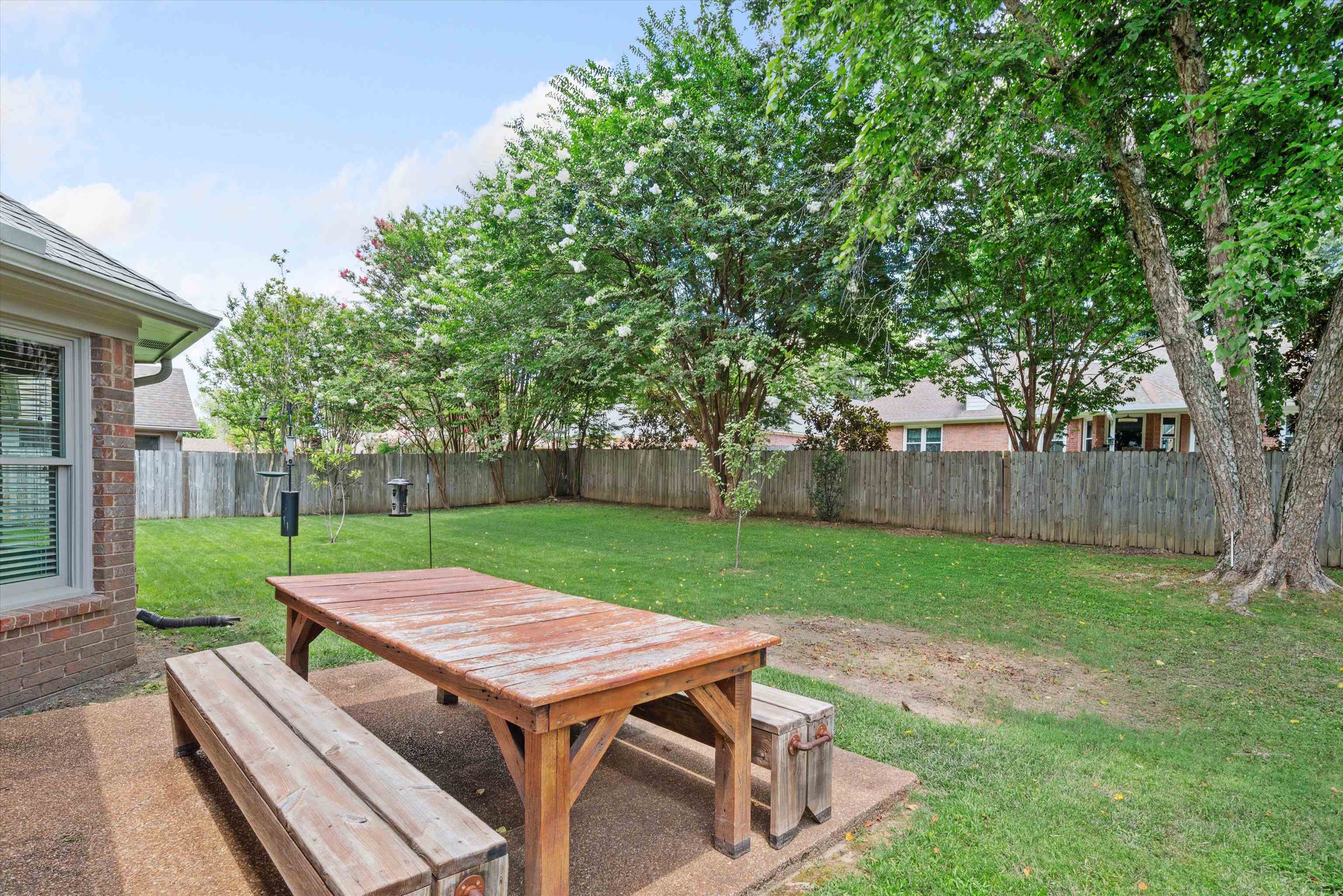 852 Joe Drive Collierville, TN 38017 - Photo 26 of 27 a view of a backyard with wooden deck and a garden