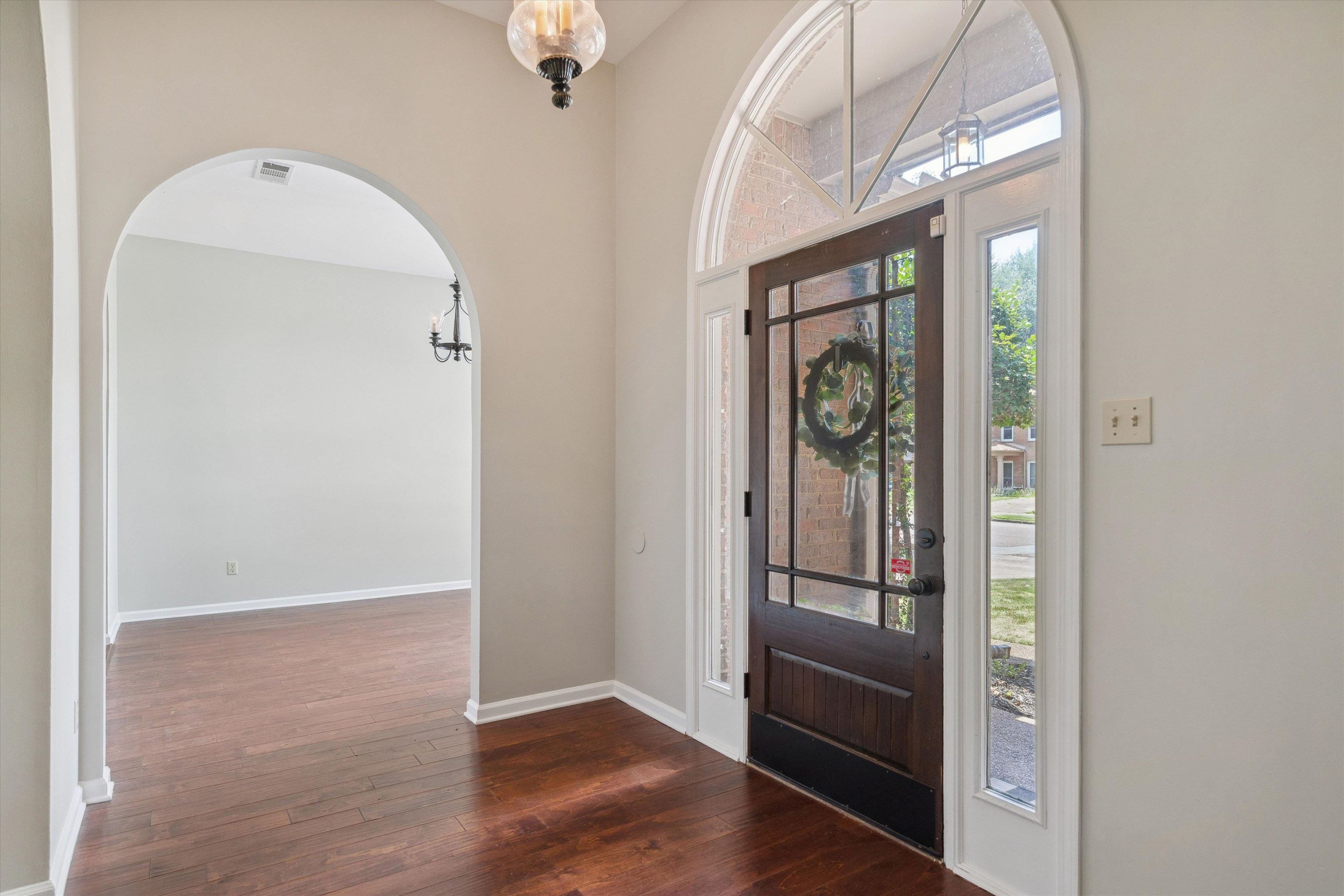 852 Joe Drive Collierville, TN 38017 - Photo 5 of 27 a view of a hallway with wooden floor and entryway