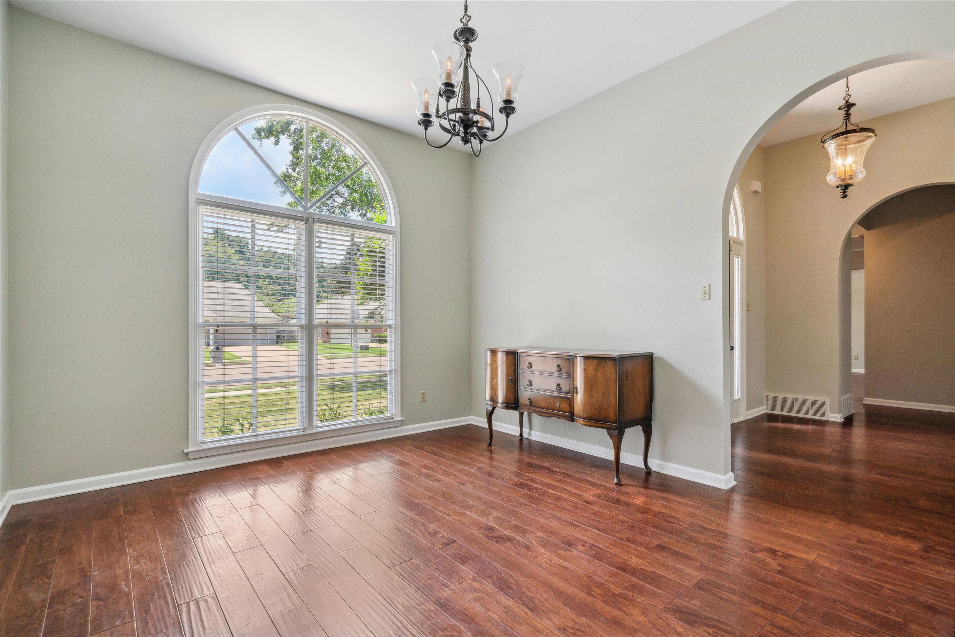 852 Joe Drive Collierville, TN 38017 - Photo 6 of 27 a view of an empty room with wooden floor and a window