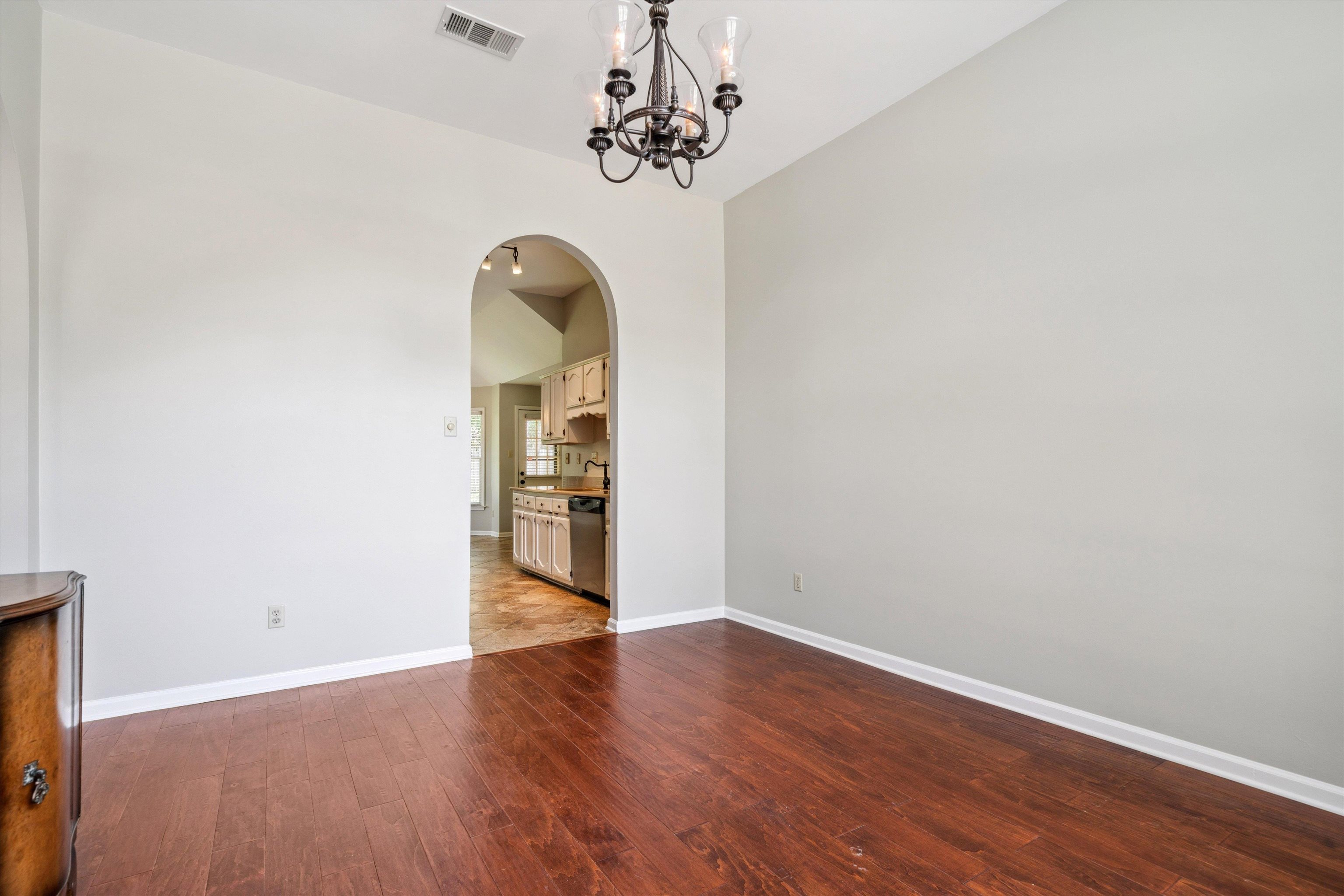 852 Joe Drive Collierville, TN 38017 - Photo 7 of 27 a view of a room with wooden floor chandelier and a window