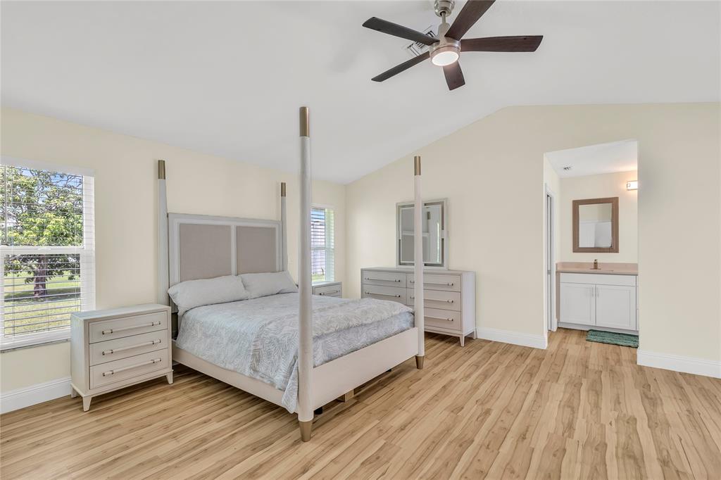8410 Sawpine Road Delray Beach, FL 33446 - Photo 25 of 37 a bedroom with a bed and a view of kitchen