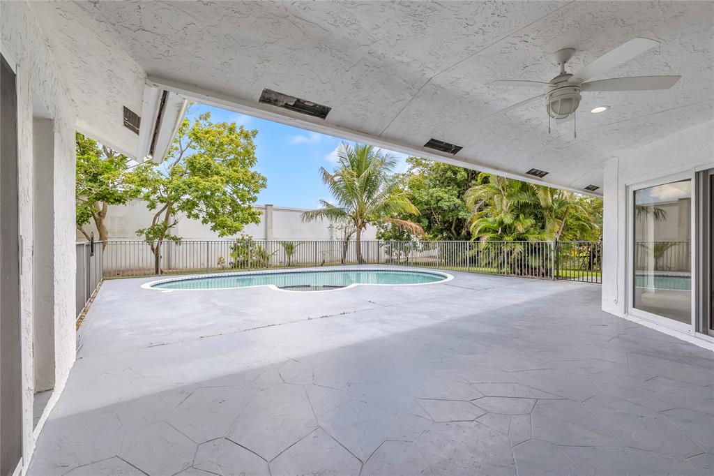 8410 Sawpine Road Delray Beach, FL 33446 - Photo 31 of 37 a view of a garden from a porch
