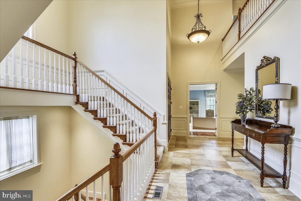 12056 Open Run Road Ellicott City, MD 21042 - Photo 34 of 114 Love this grand staircase in the foyer