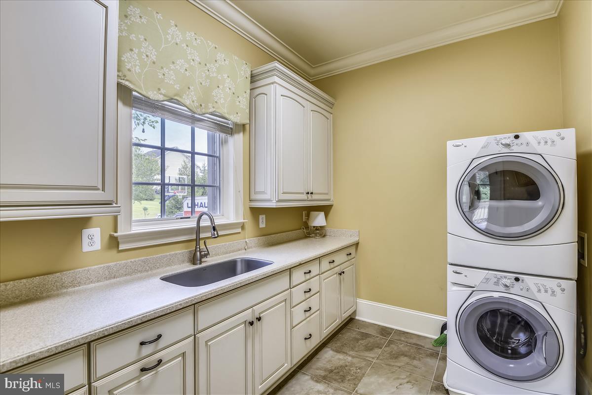 12056 Open Run Road Ellicott City, MD 21042 - Photo 92 of 114 Main level Laundry room with garage and patio acce