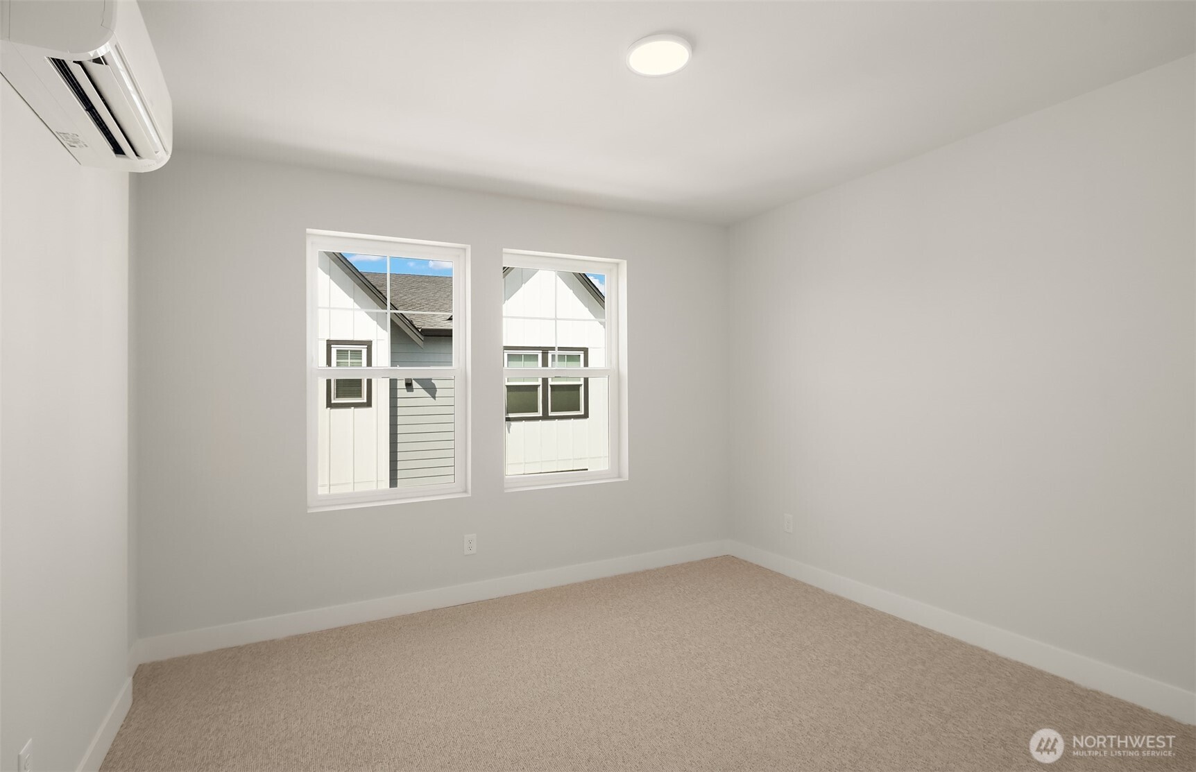 20347 90th Drive Northeast, Unit C Bothell, WA 98011 - Photo 13 of 18 an empty room with windows