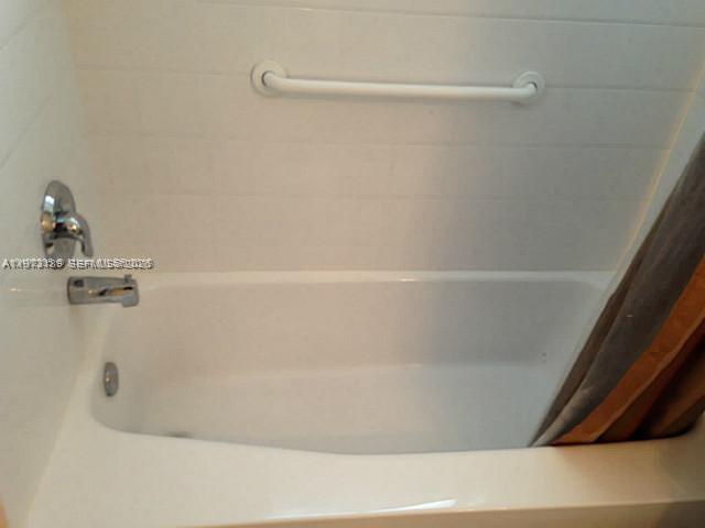 901 South Surf Road, Unit 402 Hollywood, FL 33019 - Photo 16 of 25 a close up of a bathtub