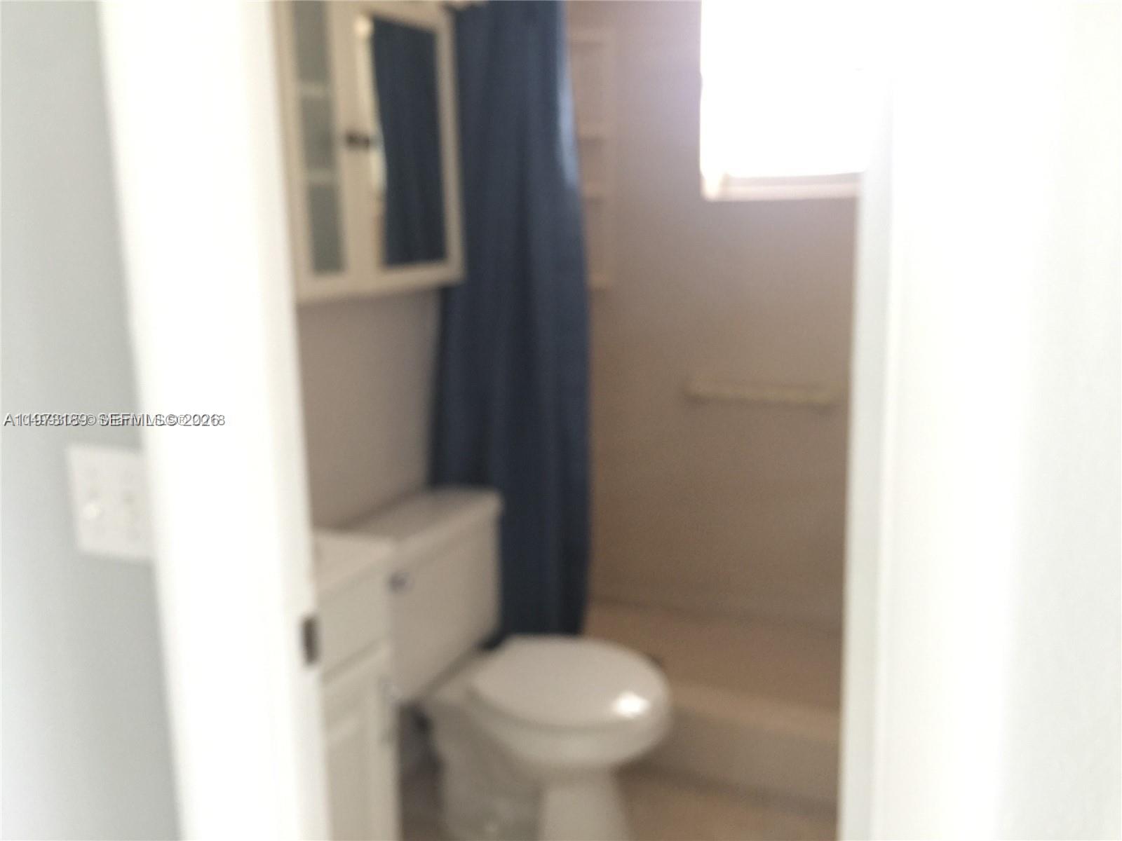 901 South Surf Road, Unit 402 Hollywood, FL 33019 - Photo 20 of 25 a bathroom with a toilet