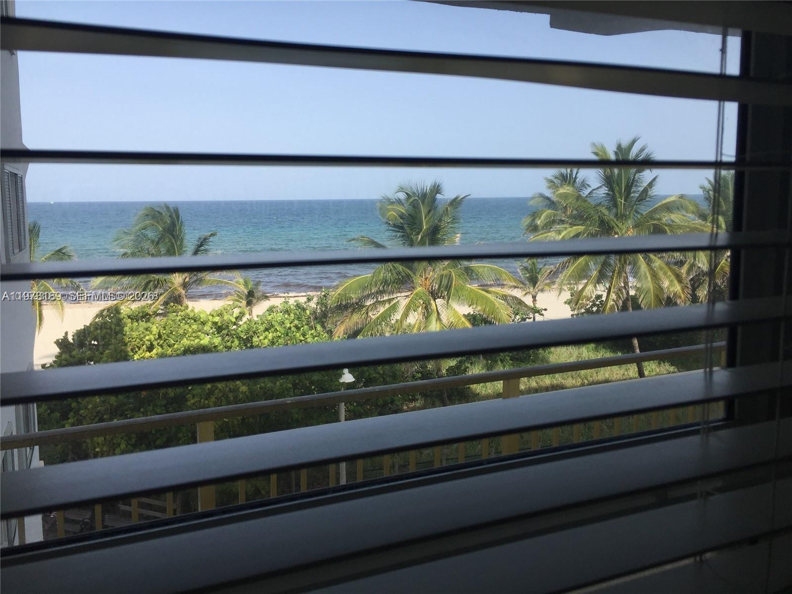 901 South Surf Road, Unit 402 Hollywood, FL 33019 - Photo 3 of 25 a view of a couple of a bench