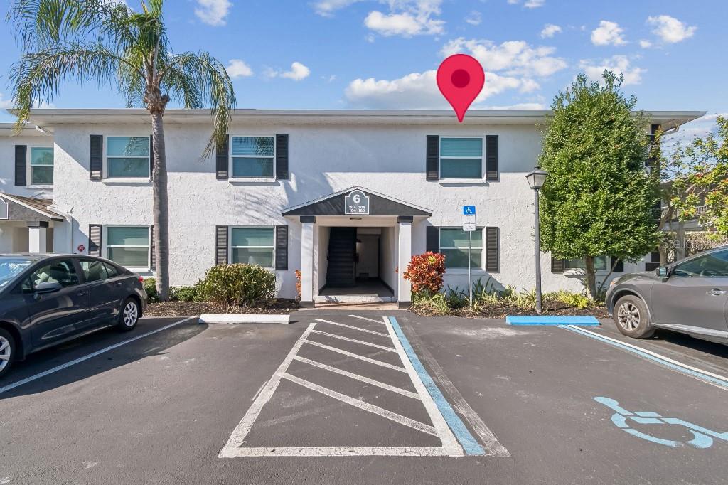 13125 Wilcox Road, Unit 6205 Largo, FL 33774 - Photo 2 of 48 a front view of a house with yard