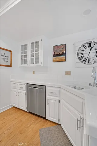a kitchen with cabinets and window