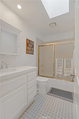 a bed room with a bed and a chair