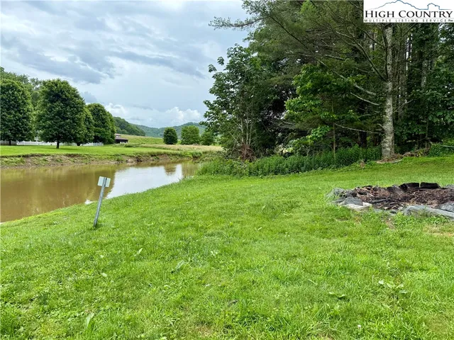 a view of a lake with a yard