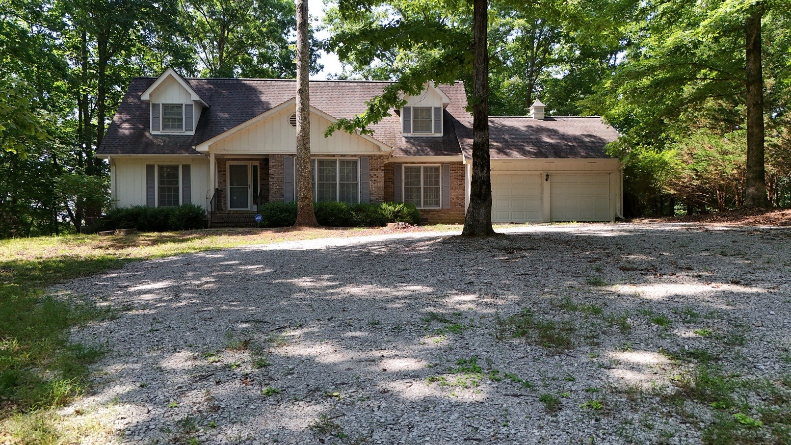 1454 Stagecoach Road Sewanee, TN 37375 - Photo 2 of 75 a front view of a house with a yard and garage