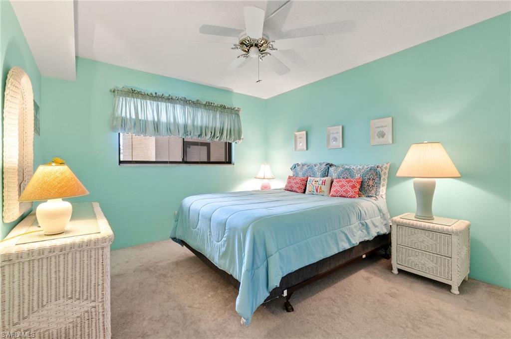 400 Lenell Road, Unit 110 Fort Myers Beach, FL 33931 - Photo 17 of 37 a bedroom with a bed and window