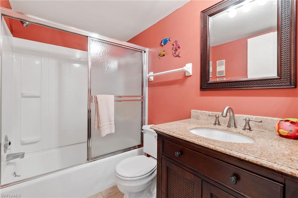 400 Lenell Road, Unit 110 Fort Myers Beach, FL 33931 - Photo 22 of 37 a bathroom with a granite countertop sink toilet and shower
