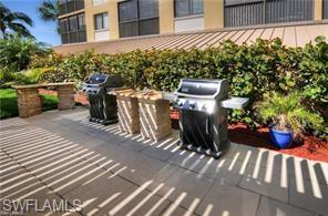 400 Lenell Road, Unit 110 Fort Myers Beach, FL 33931 - Photo 25 of 37 a view of a chairs and table in the patio