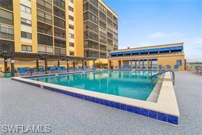 400 Lenell Road, Unit 110 Fort Myers Beach, FL 33931 - Photo 28 of 37 a view of swimming pool with a backyard