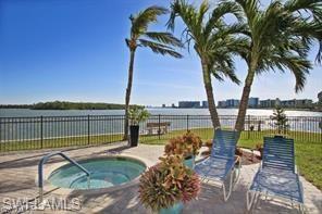 400 Lenell Road, Unit 110 Fort Myers Beach, FL 33931 - Photo 5 of 37 a view of a swimming pool with a patio and ocean view