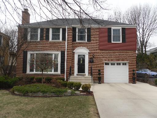 4708 Wolf Road Western Springs, IL 60558 - Photo 1 of 14 a front view of a house with a yard and garage