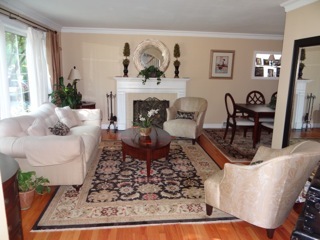 4708 Wolf Road Western Springs, IL 60558 - Photo 2 of 14 a living room with furniture a rug and a fireplace