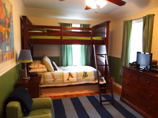4708 Wolf Road Western Springs, IL 60558 - Photo 11 of 14 a bedroom with a bed and wooden floor