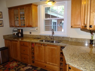 4708 Wolf Road Western Springs, IL 60558 - Photo 4 of 14 a kitchen with wooden cabinets and a sink