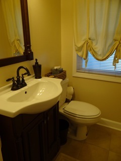 4708 Wolf Road Western Springs, IL 60558 - Photo 6 of 14 a bathroom with a sink and a toilet