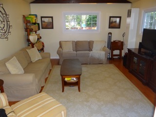 4708 Wolf Road Western Springs, IL 60558 - Photo 7 of 14 a living room with furniture and a flat screen tv
