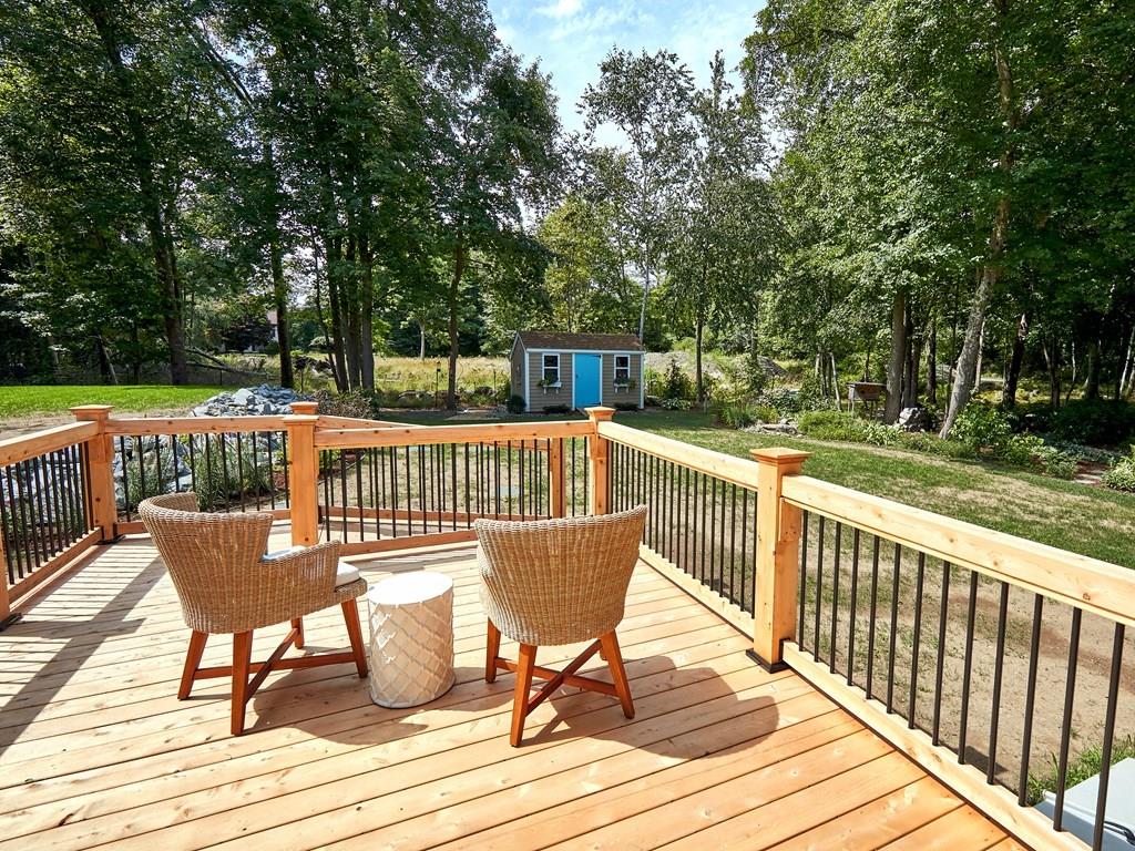 15 Highland Ridge Road Freetown, MA 02702 - Photo 11 of 42 a view of a deck with chairs and wooden floor