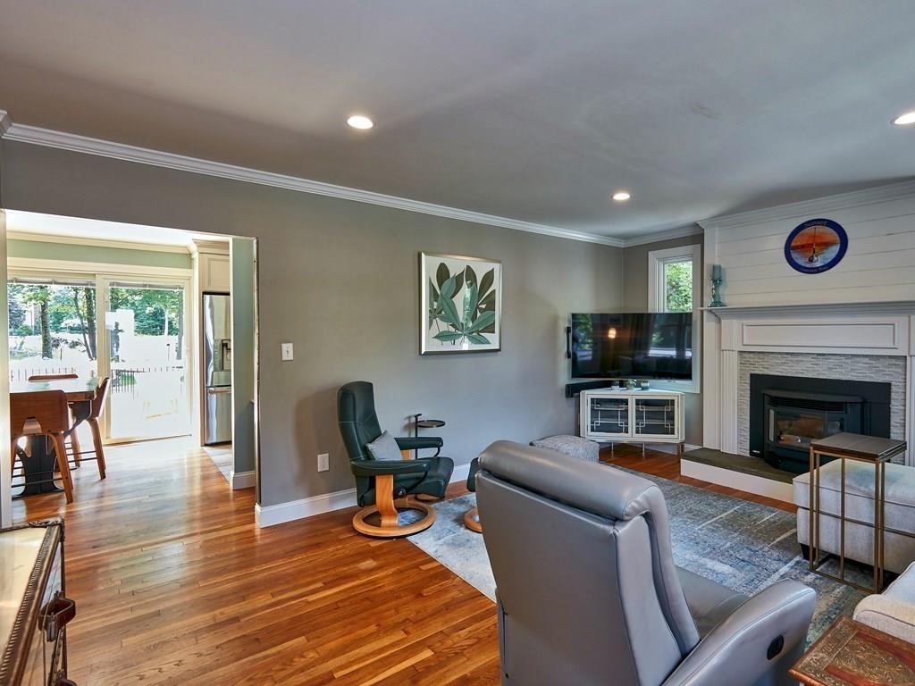 15 Highland Ridge Road Freetown, MA 02702 - Photo 16 of 42 a living room with furniture a flat screen tv and a fireplace