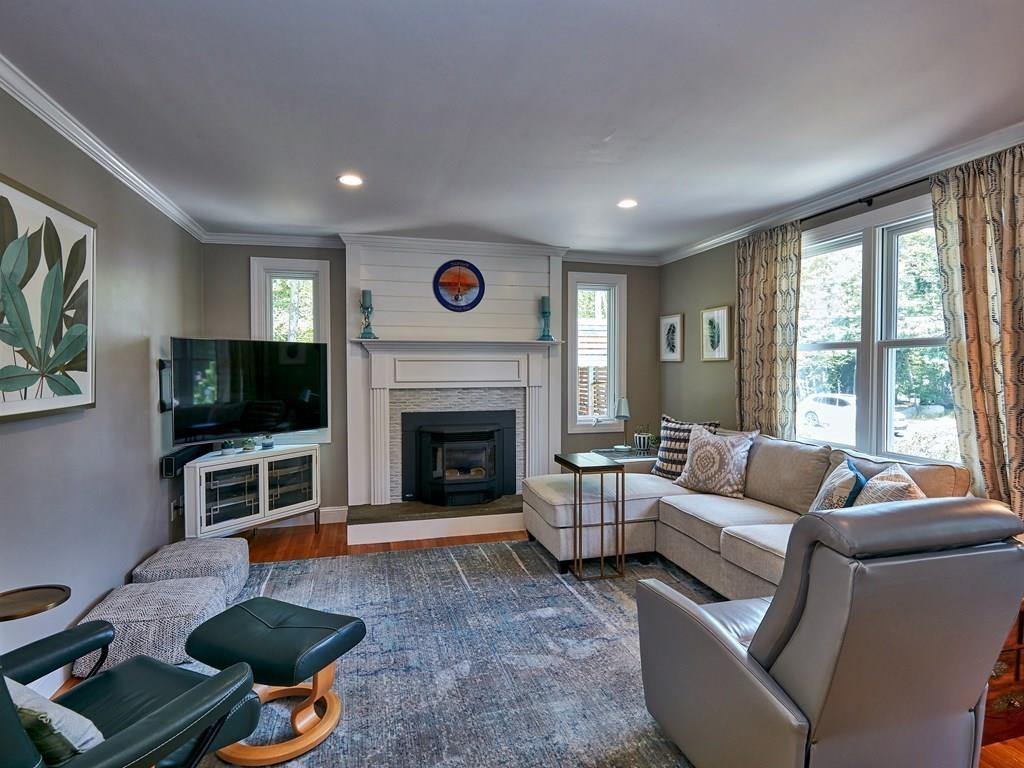 15 Highland Ridge Road Freetown, MA 02702 - Photo 17 of 42 a living room with furniture a flat screen tv and a fireplace