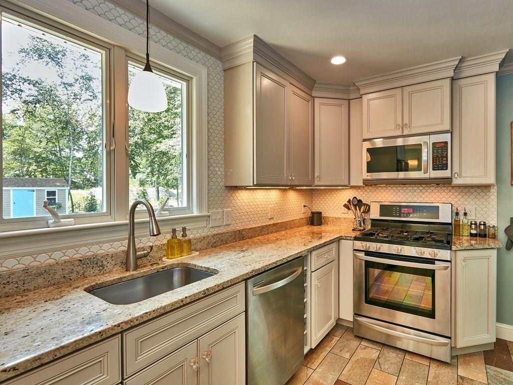 15 Highland Ridge Road Freetown, MA 02702 - Photo 21 of 42 a kitchen with granite countertop a sink stainless steel appliances and cabinets