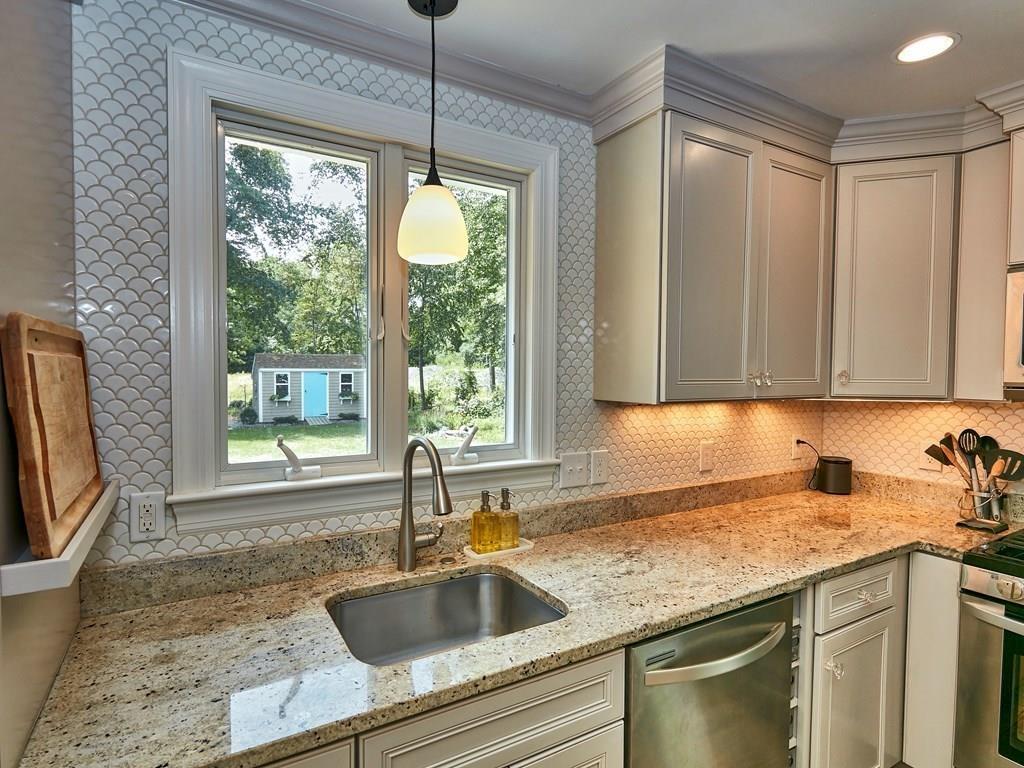 15 Highland Ridge Road Freetown, MA 02702 - Photo 23 of 42 a kitchen with granite countertop a sink and a window