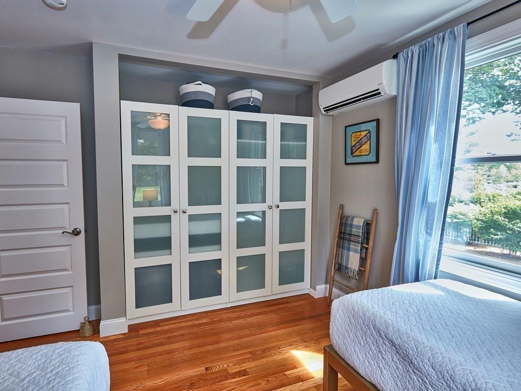 15 Highland Ridge Road Freetown, MA 02702 - Photo 28 of 42 a view of a bedroom with wooden floor and windows