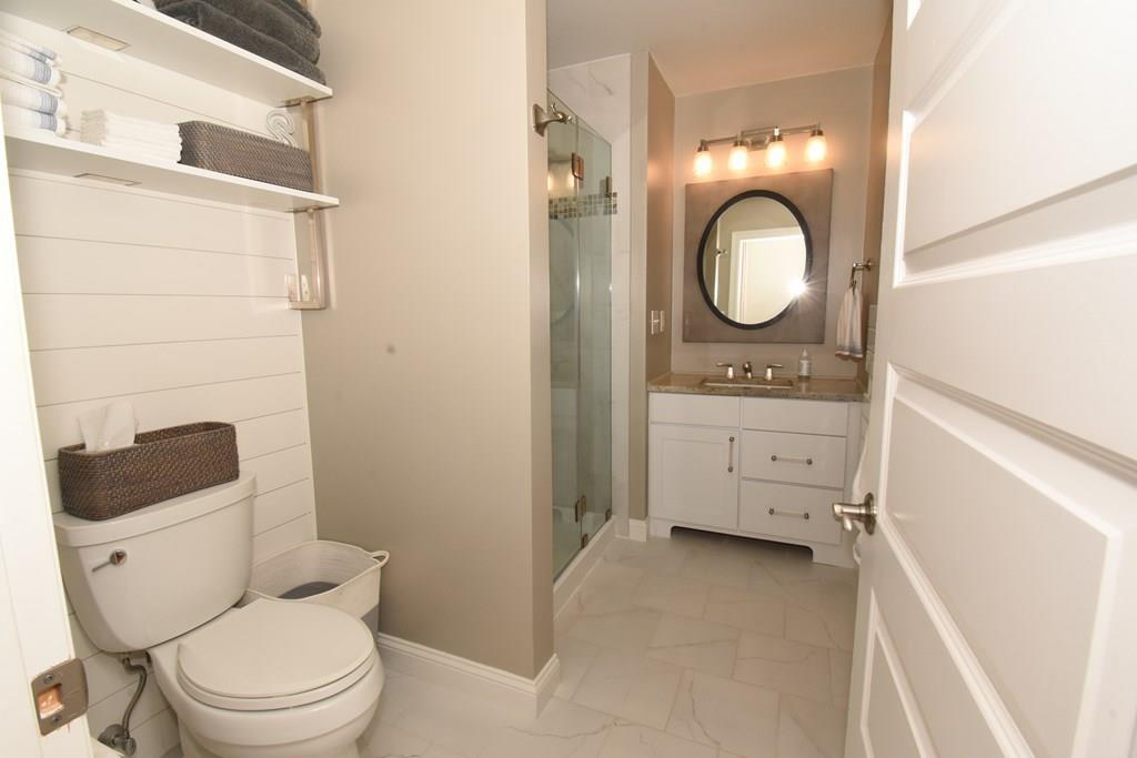 15 Highland Ridge Road Freetown, MA 02702 - Photo 32 of 42 a bathroom with a toilet a sink and a mirror
