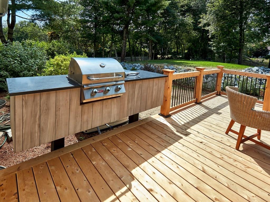 15 Highland Ridge Road Freetown, MA 02702 - Photo 10 of 42 a view of a wooden deck with furniture