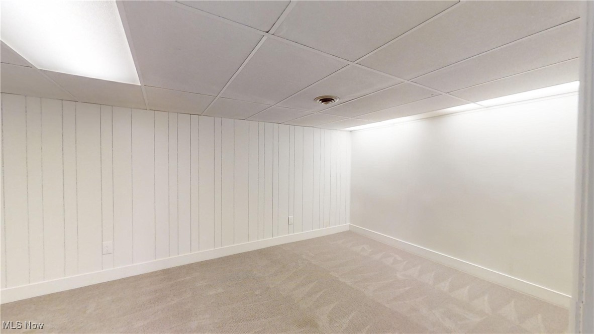 5681 Navarre Road Southwest Canton, OH 44706 - Photo 15 of 20 Spare room with a drop ceiling and carpet floors in basement